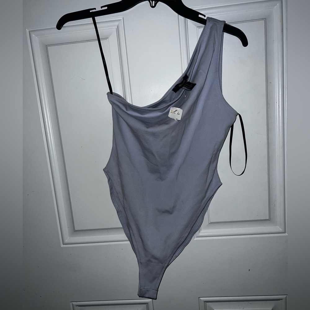 Blue one sleeve bodysuit